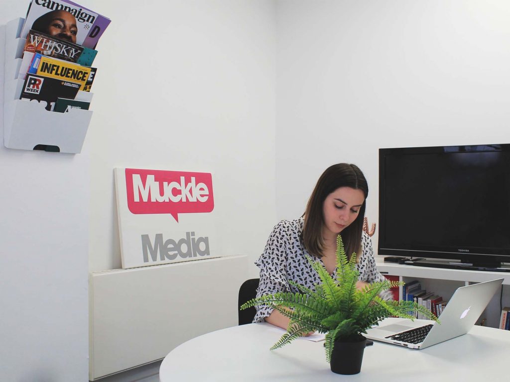 Intern, Emily in the Muckle Media board room